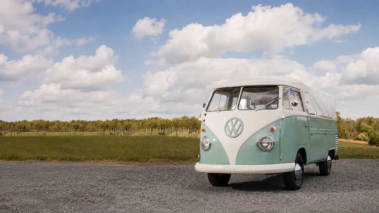 Vintage mint and white VW bus named Rosi parked at a vineyard, set up for cozy events and brand activations.